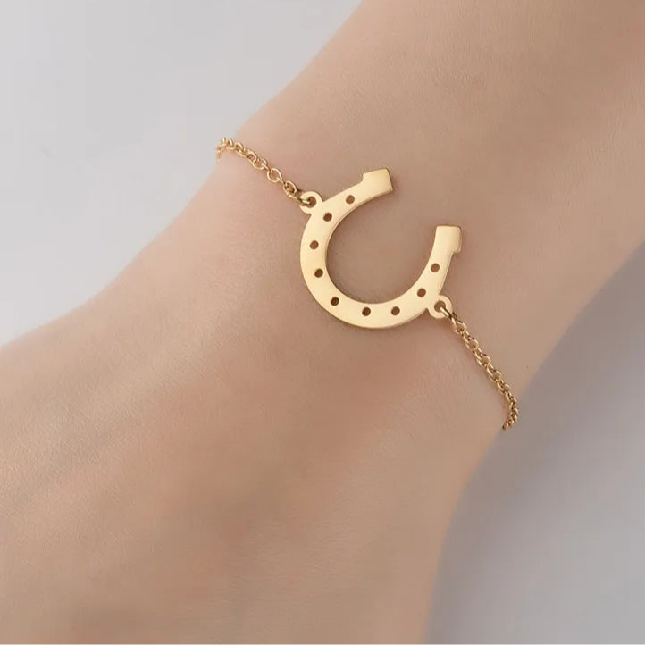 Pulseira Ferradura de Aço Dourada